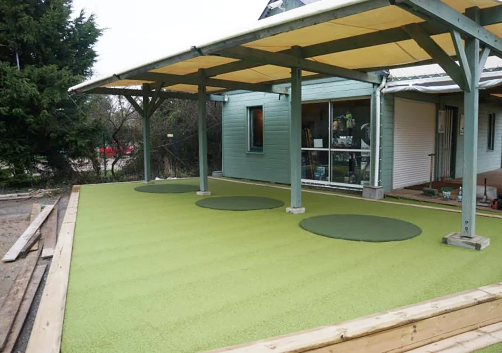 Artificial turf walkway under a covered area