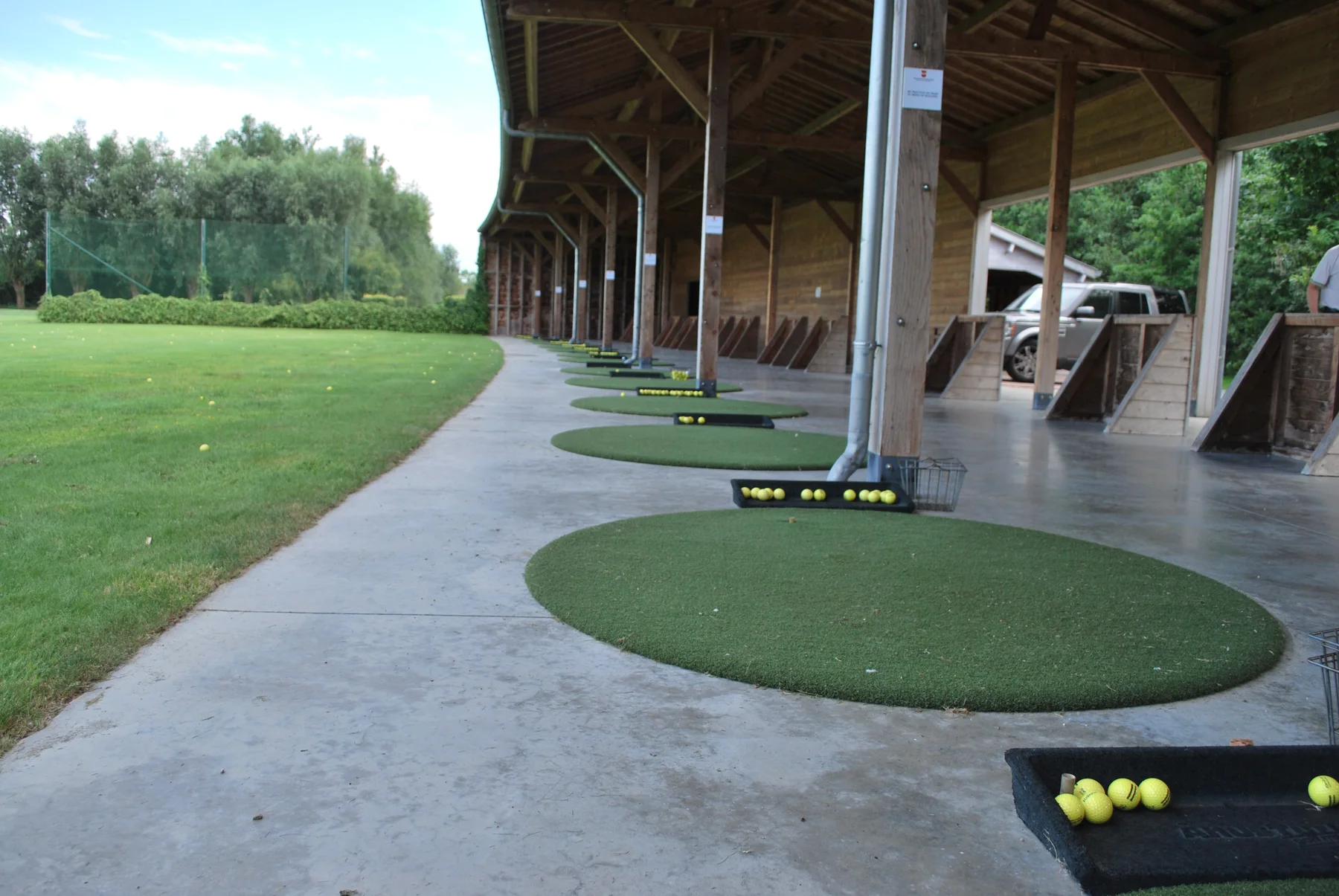 Round driving range mats with range balls